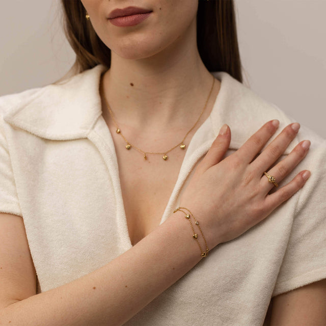 Roségoldenes Schmuckset von PURELEI mit zarten Herzdetails, elegant und feminin.